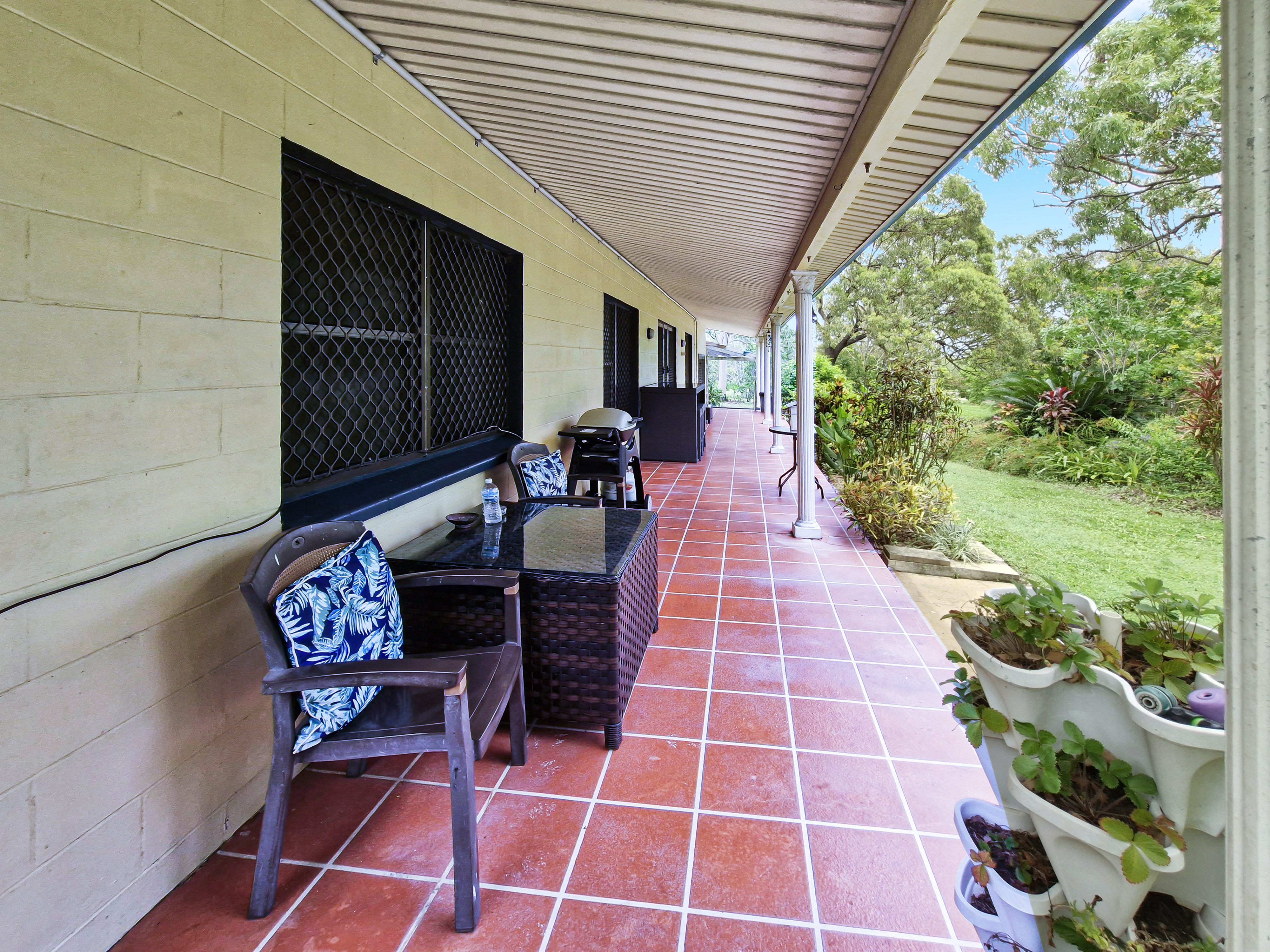 Spacious 5-Acres with Solid Block Home, Income-Generating Studio, and Extensive Sheds & Machinery