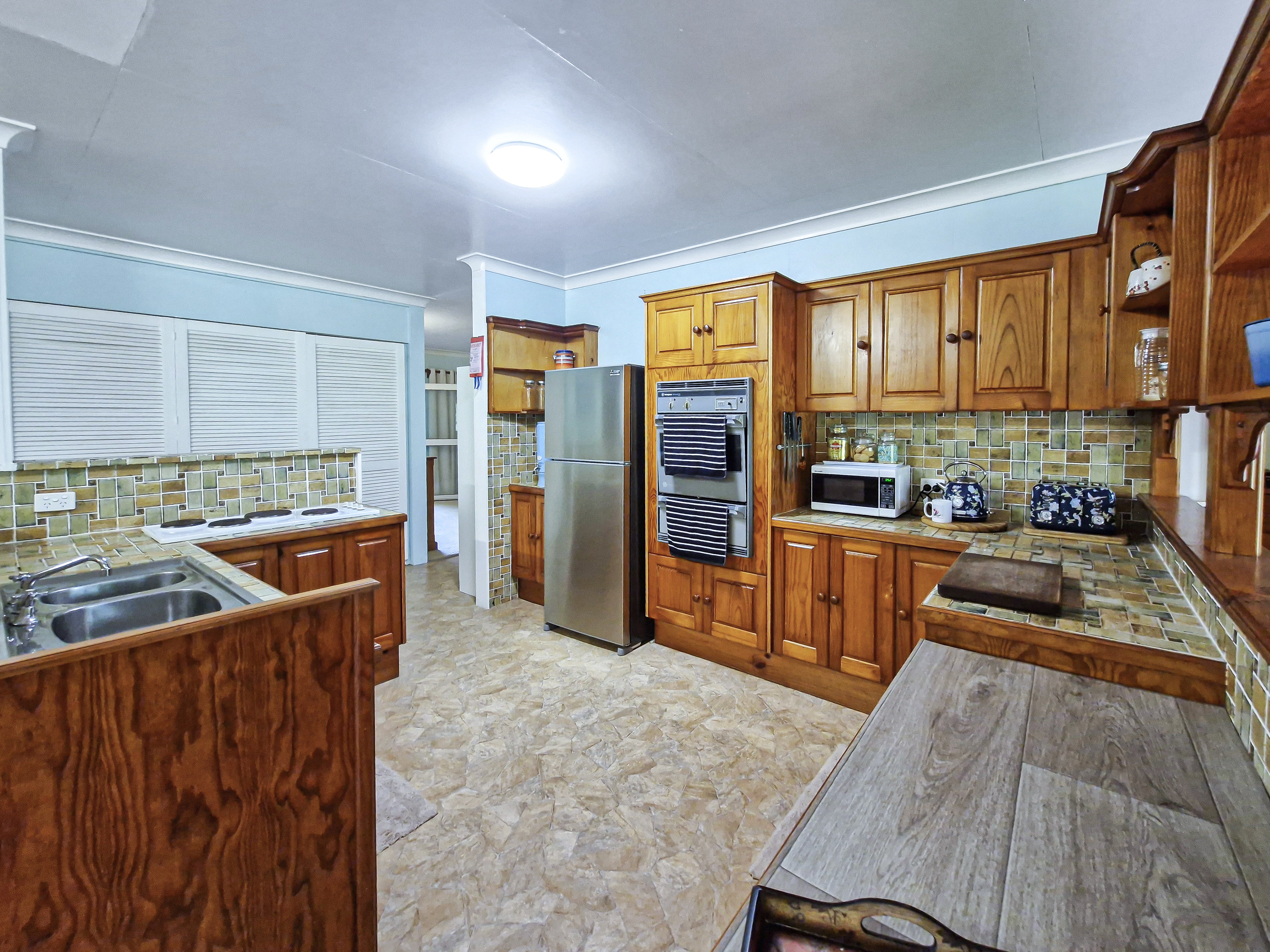 Spacious 5-Acres with Solid Block Home, Income-Generating Studio, and Extensive Sheds & Machinery