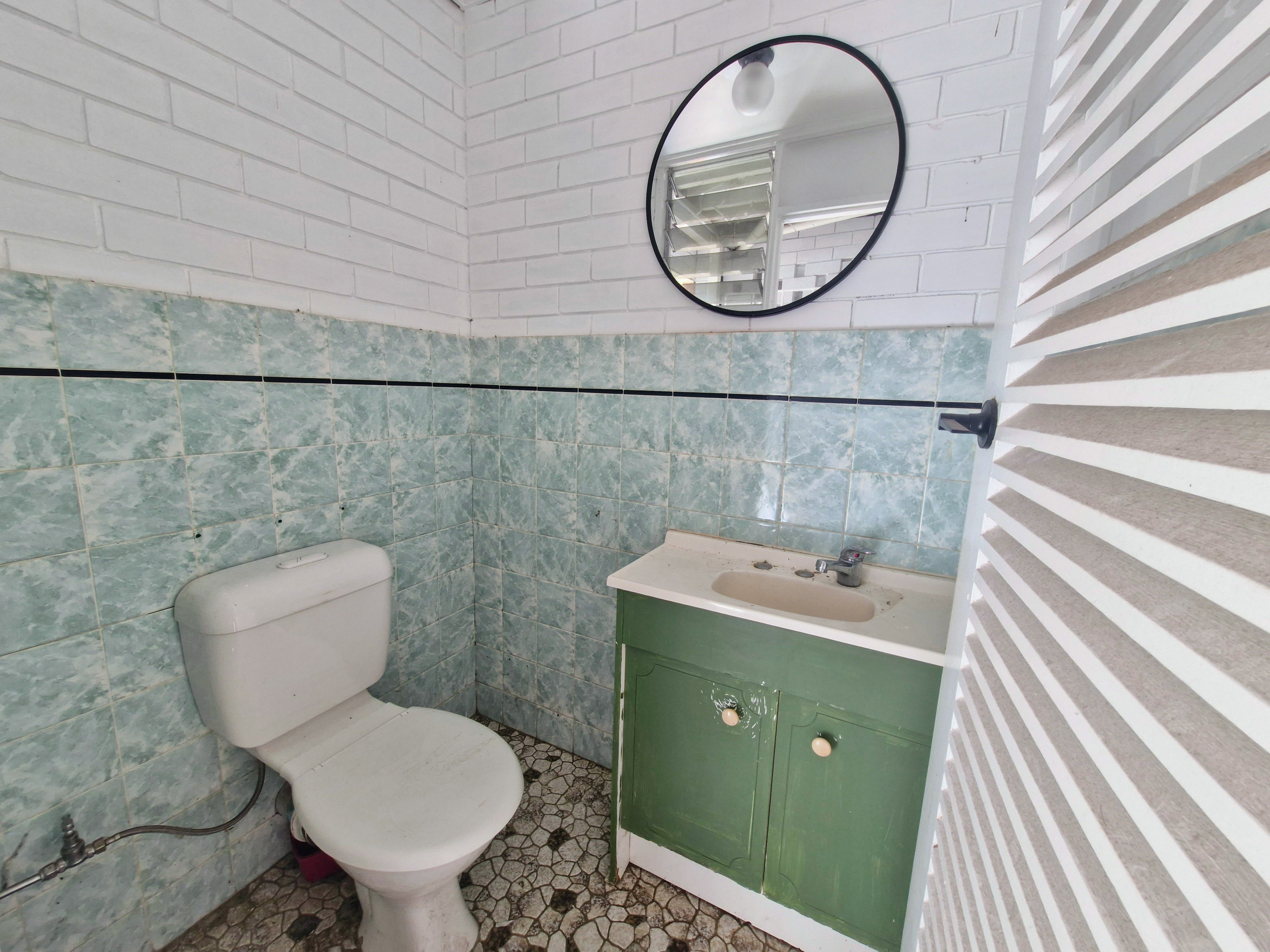 Endless Potential in a Spacious Family Home with Ocean Glimpses and Modern Touches