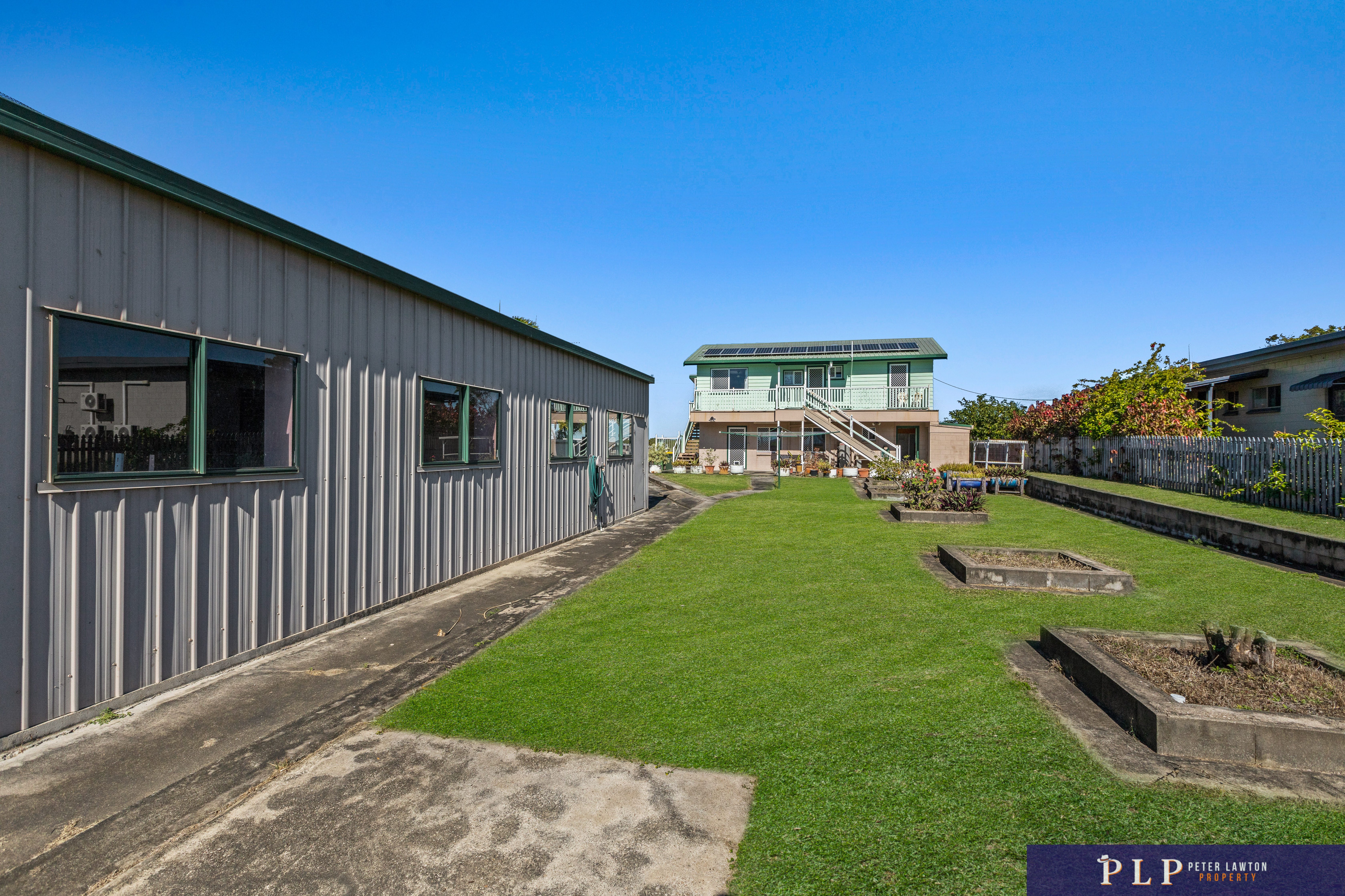 Spacious Dual-Level Home with OCEAN VIEWS, Shed, Solar & Extras Galore