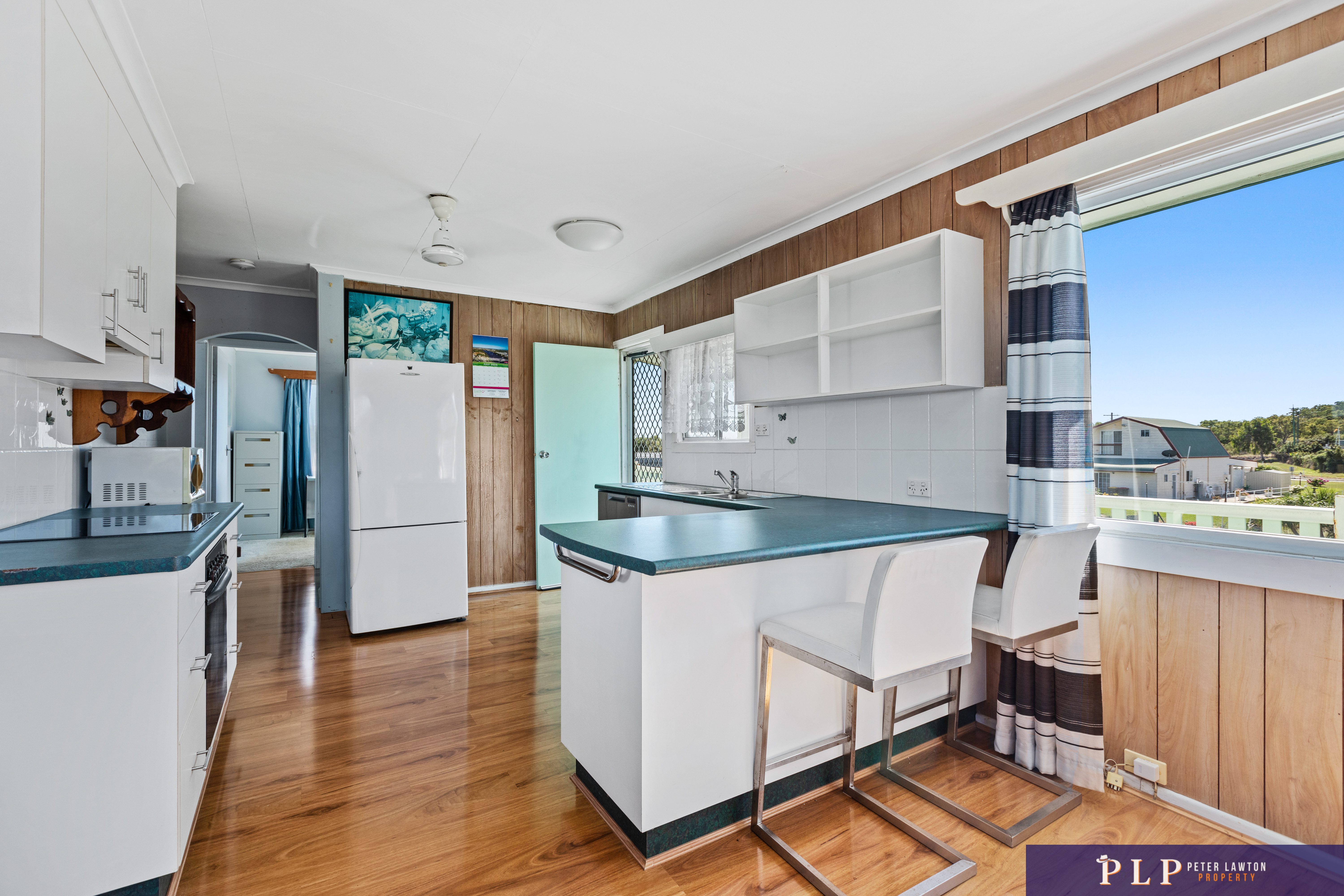 Spacious Dual-Level Home with OCEAN VIEWS, Shed, Solar & Extras Galore